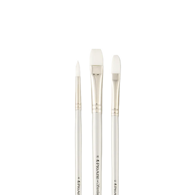 Three paintbrushes with white bristles on a gray background