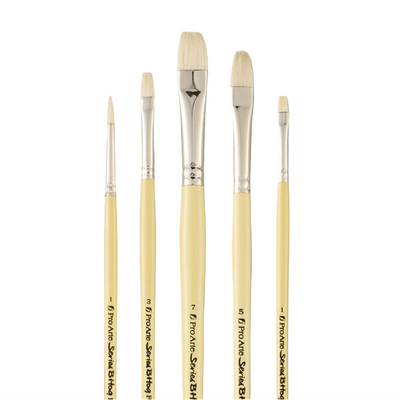 Set of five paintbrushes with wooden handles and metal ferrules on a gray background